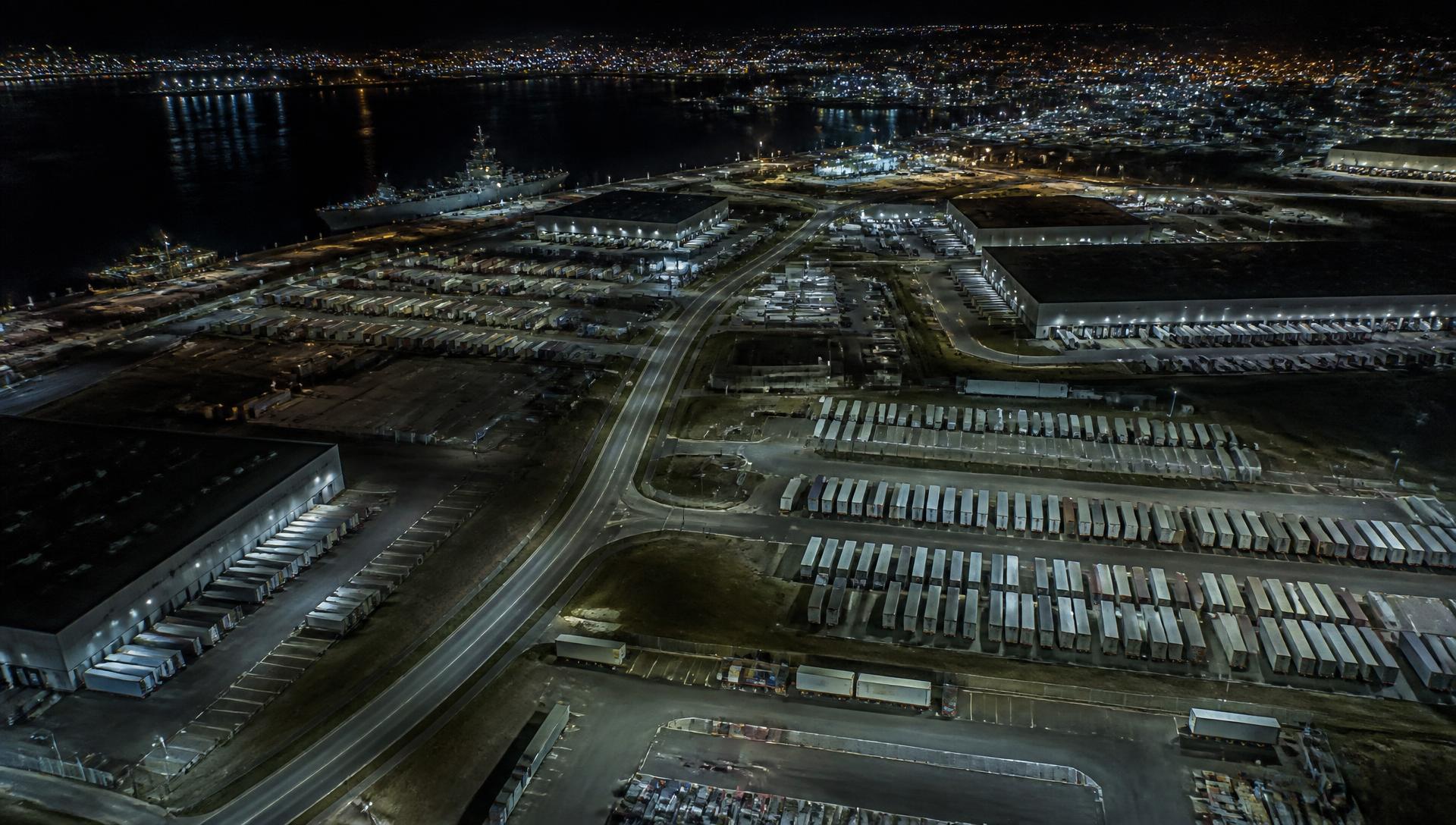 Aerial view of a port and industrial logistics area at night